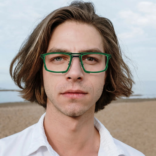 Model wearing Barledear Electric Ivy Black eyeglasses in a lifestyle portrait with lightweight square titanium frame styling