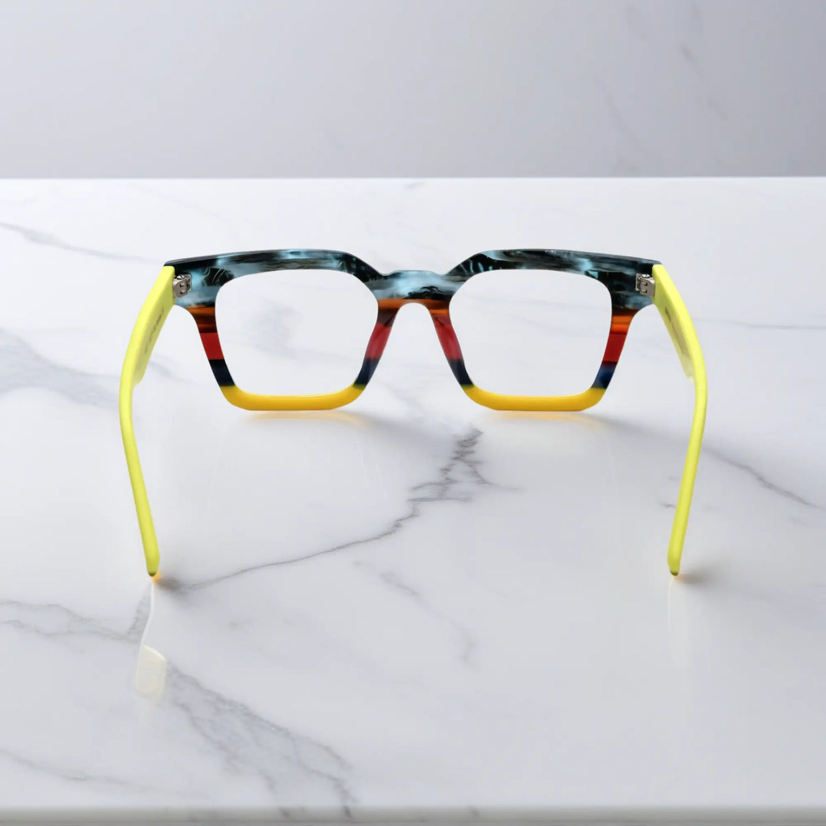 Back view of Citrus Fade eyeglasses with orange and yellow matte block pattern