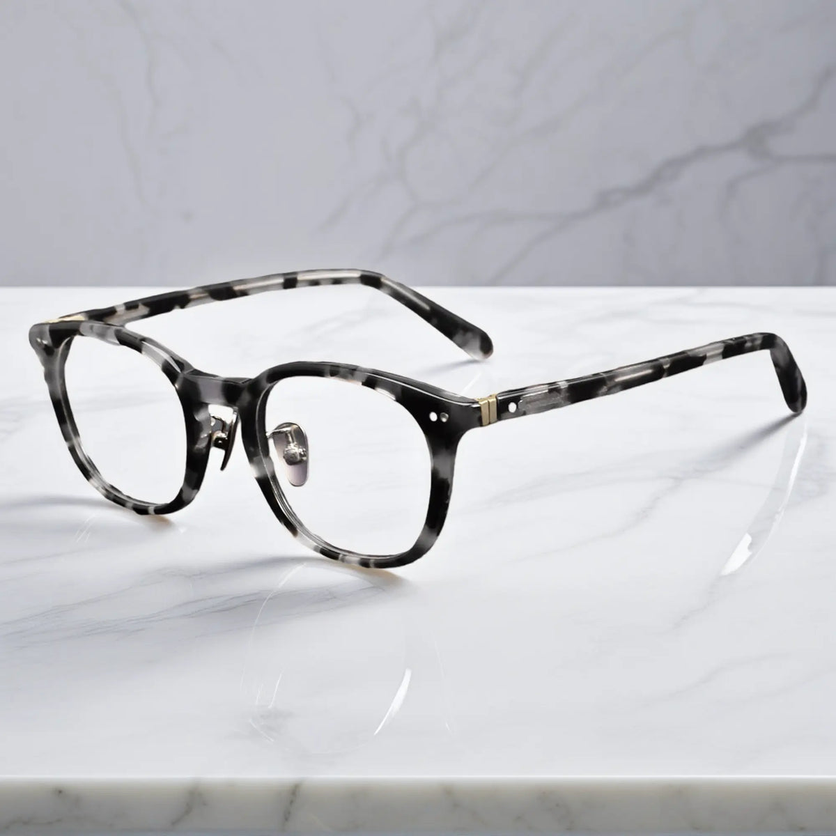 side view showing titanium nose pads and metal rivet hinge detail of KA62 leopard tortoise color frame