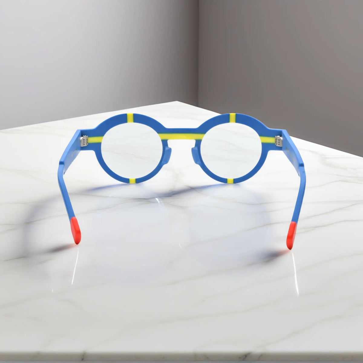 Angled look at cobalt blue VoyueLens glasses, styled with matte geometric detailing.