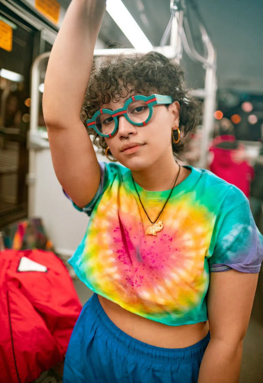 Model wearing VoyueLens Retro Geometric Round Glasses in forest green, styled with a modern matte finish.