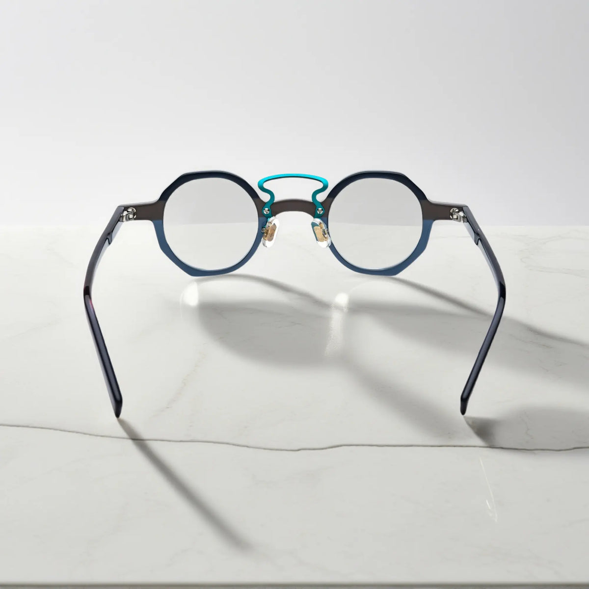 Angled perspective showing VoyueLens VL19244 Forest Grey Mist lightweight geometric eyeglasses