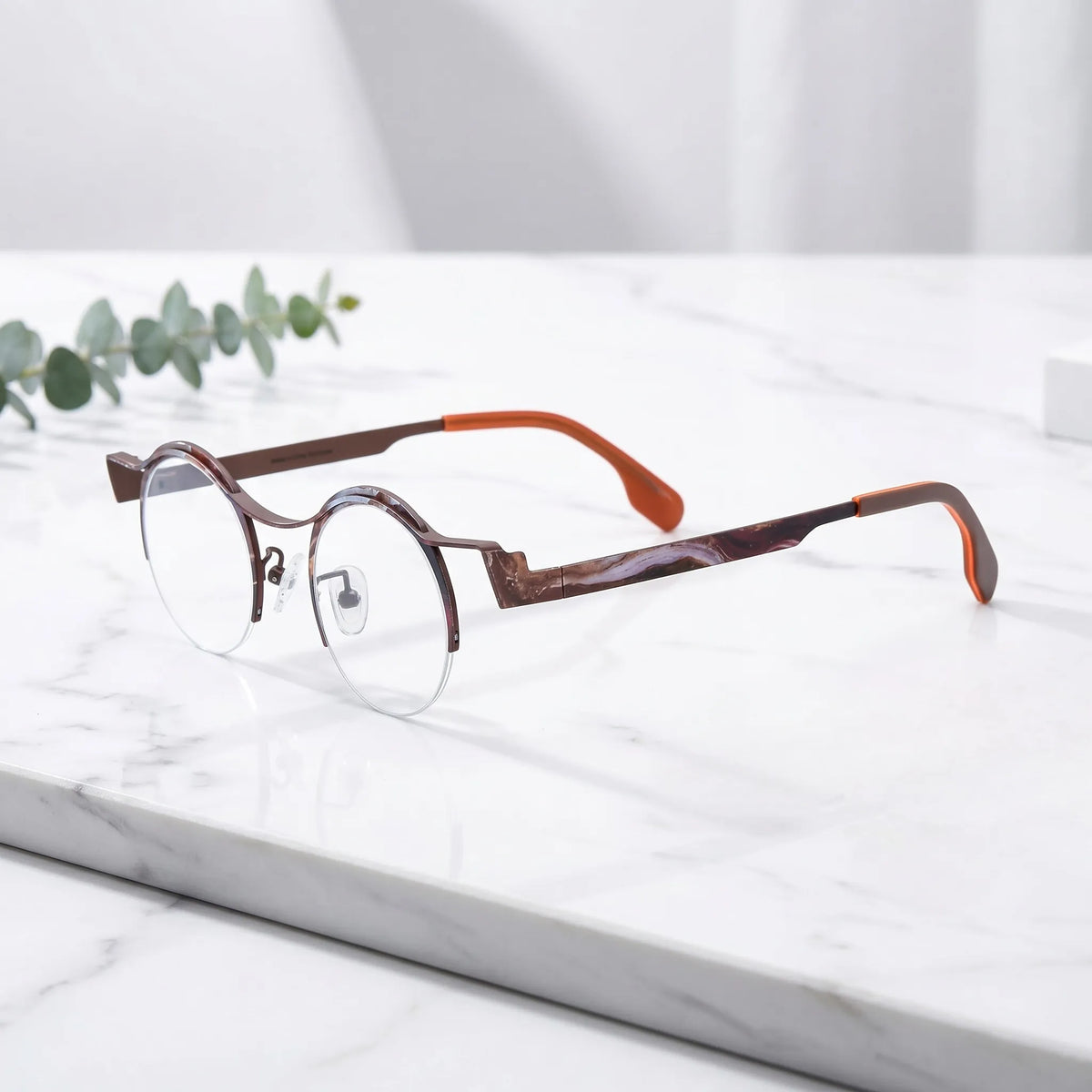 Barledear Amber Cocoa eyeglasses angled side view showing brown temple details, round lenses, and semi-rimless pure titanium frame