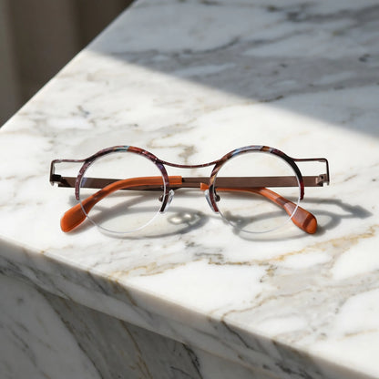 Barledear Amber Cocoa eyeglasses folded display showing slim titanium temples and warm amber color-spliced finish