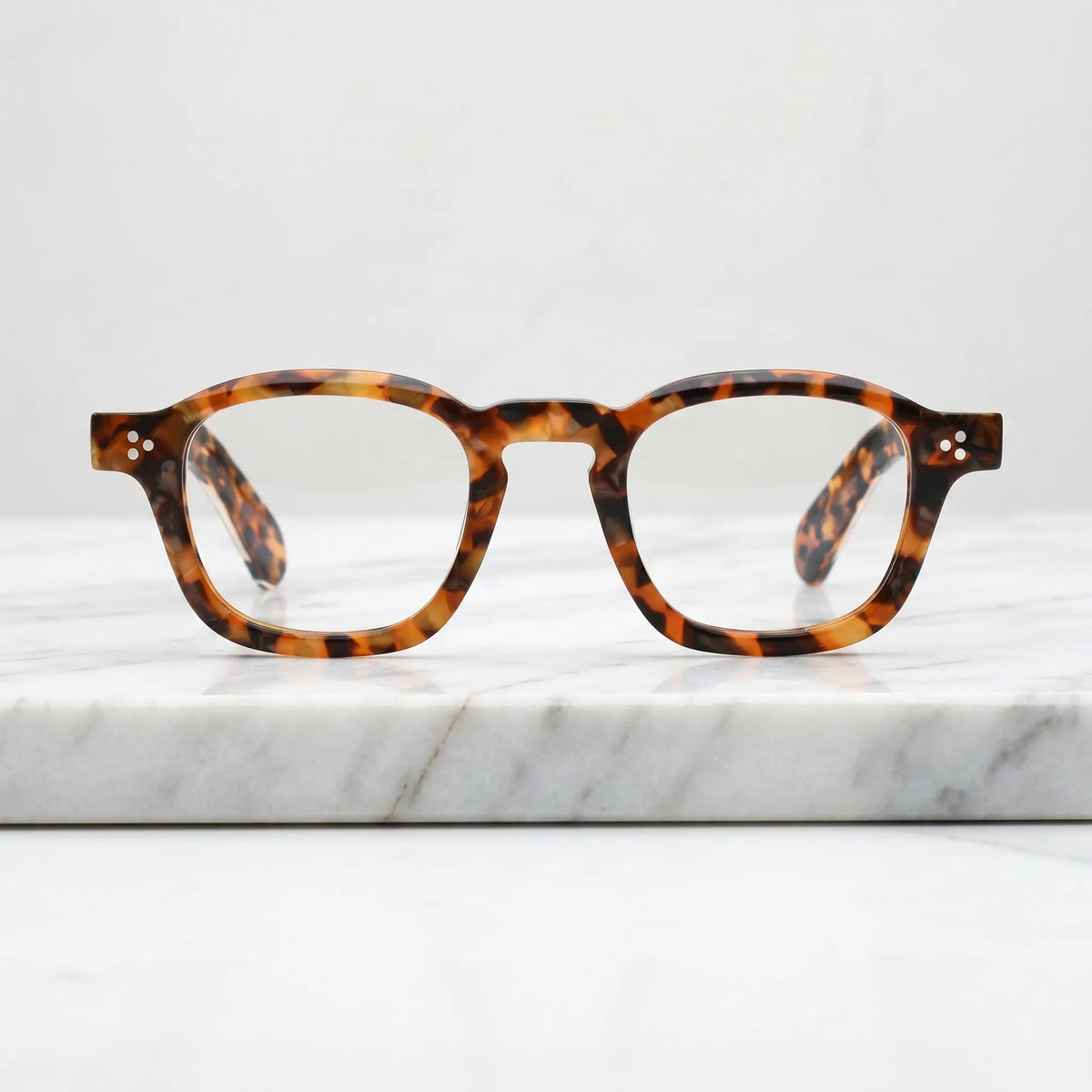 Barledear Amber Leopard Tortoise eyeglasses shown in a clean lifestyle front view with bold patterned acetate styling