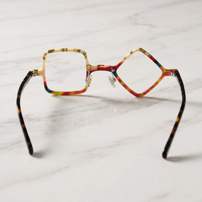 Barledear Amber Mosaic asymmetric geometric acetate eyeglasses back view showing the mismatched diamond and square shapes, clear nose pads, and black temple construction.