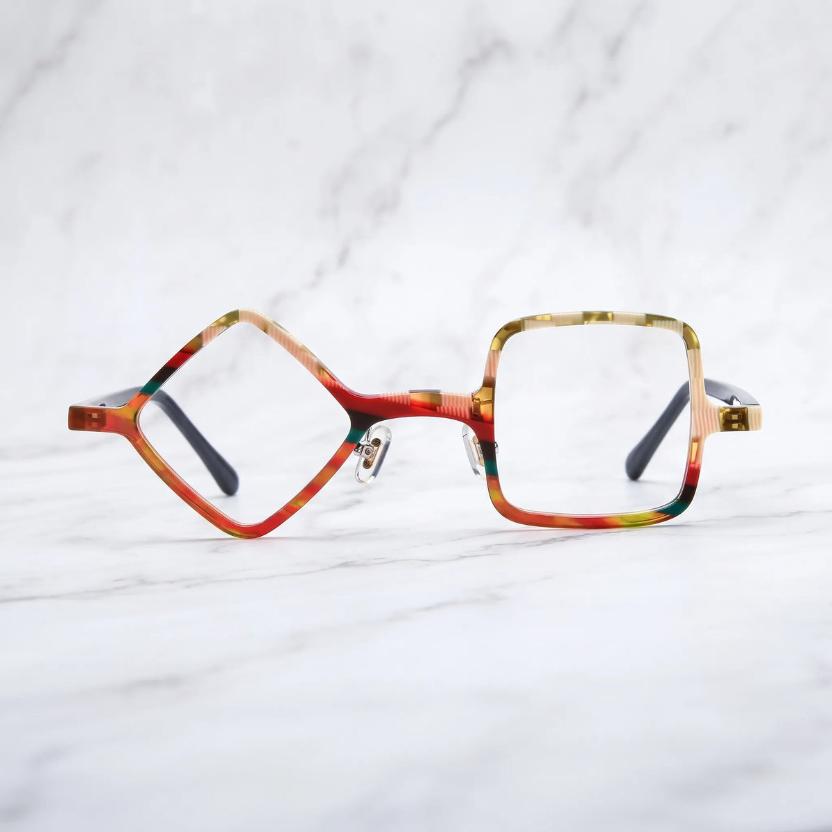 Barledear Amber Mosaic asymmetric geometric acetate eyeglasses shown in a clean lifestyle front display with warm multicolor acetate patterns.