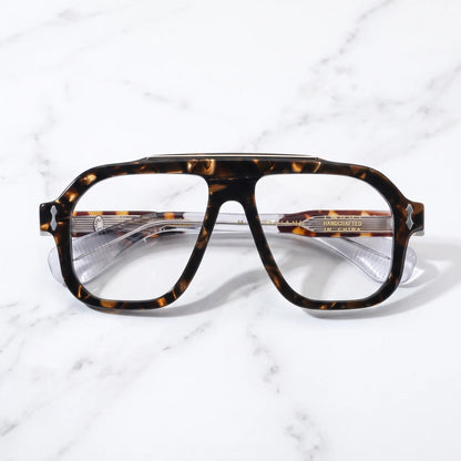 Barledear Amber Tortoise eyeglasses folded display showing the patterned acetate front, transparent temples and metal hinge detailing