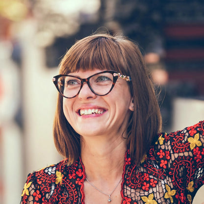 Adult woman wearing Barledear Amber Tortoise geometric cat-eye eyeglasses in an elegant fashion lifestyle portrait