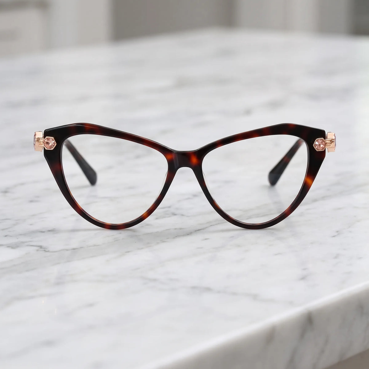 Barledear Amber Tortoise cat-eye eyeglasses shown in a warm lifestyle front display with multicolor crystal-accent temples