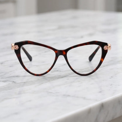 Barledear Amber Tortoise cat-eye eyeglasses shown in a warm lifestyle front display with multicolor crystal-accent temples