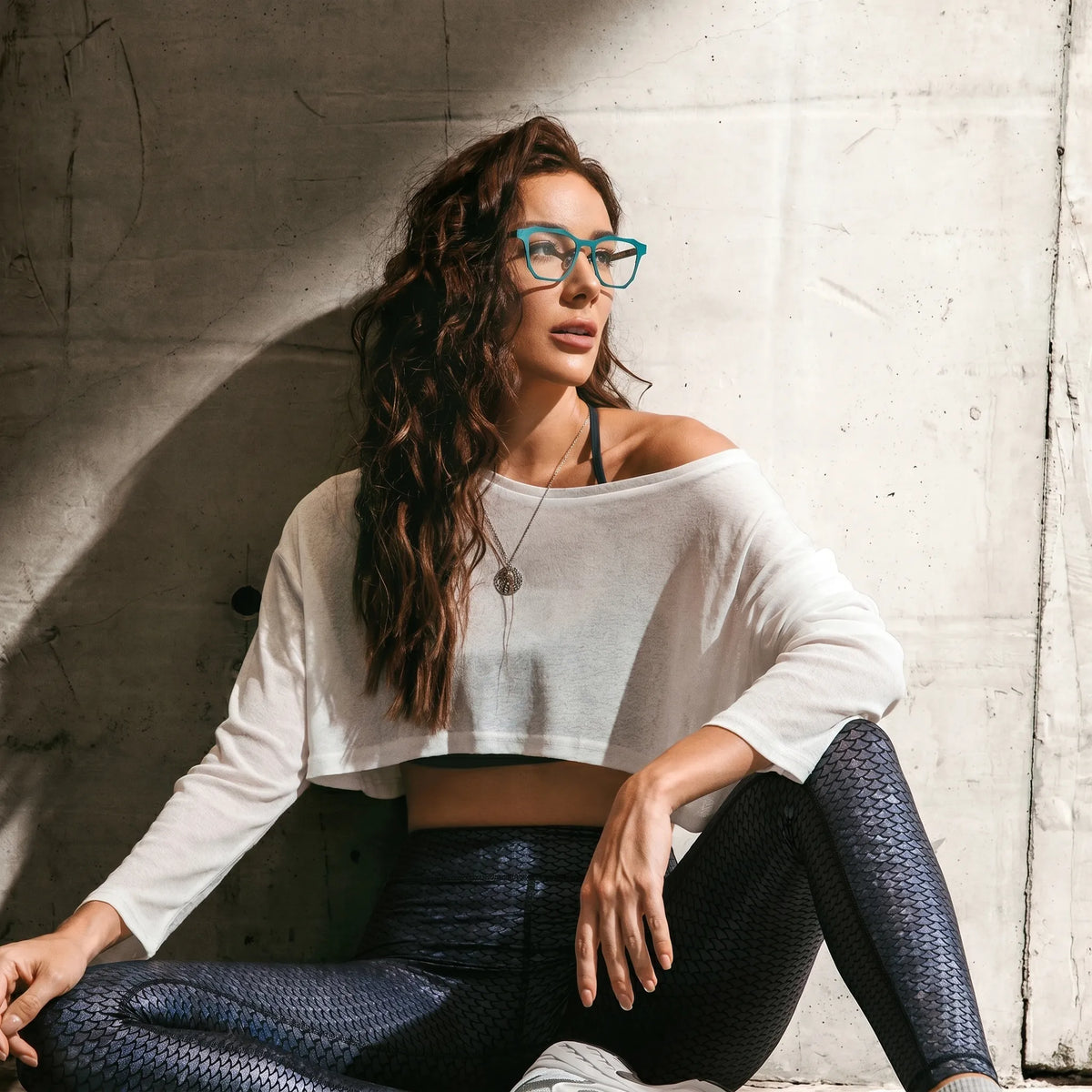 Model wearing Barledear Aqua Tortoise eyeglasses with modern geometric square titanium frame in a lifestyle portrait