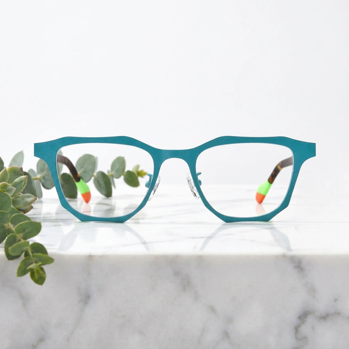 Barledear Aqua Tortoise eyeglasses shown in a clean lifestyle front view with artistic square frame design