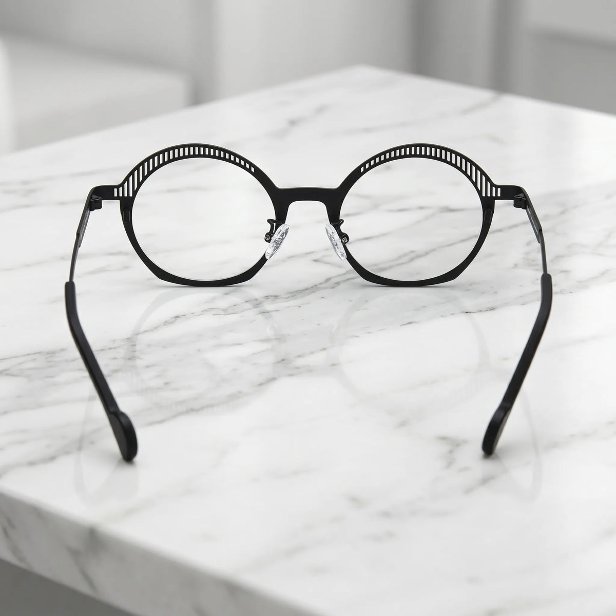 Barledear Charcoal Black eyeglasses back view showing adjustable clear silicone nose pads and prescription-ready titanium frame structure