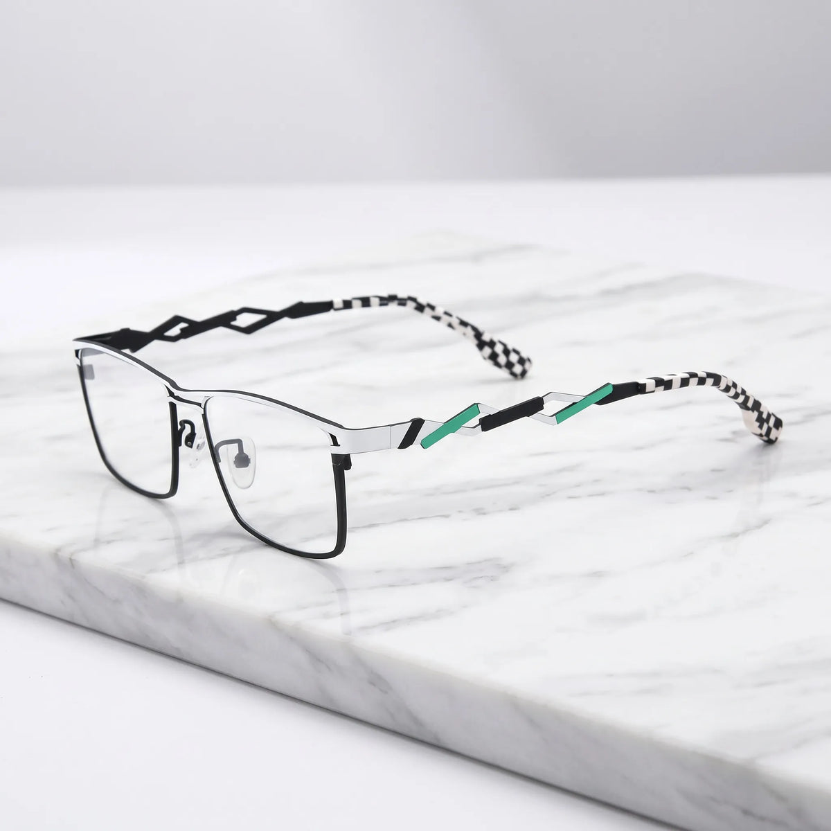 Barledear Crimson Meadow Green eyeglasses angled side view showing slim titanium structure and bold geometric temple detail