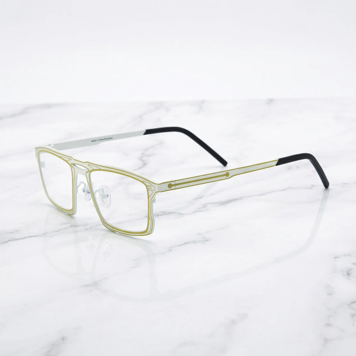 Barledear Citrus Ivory eyeglasses angled side view showing slim dual-tone temples, bridge detail, and adjustable nose pads