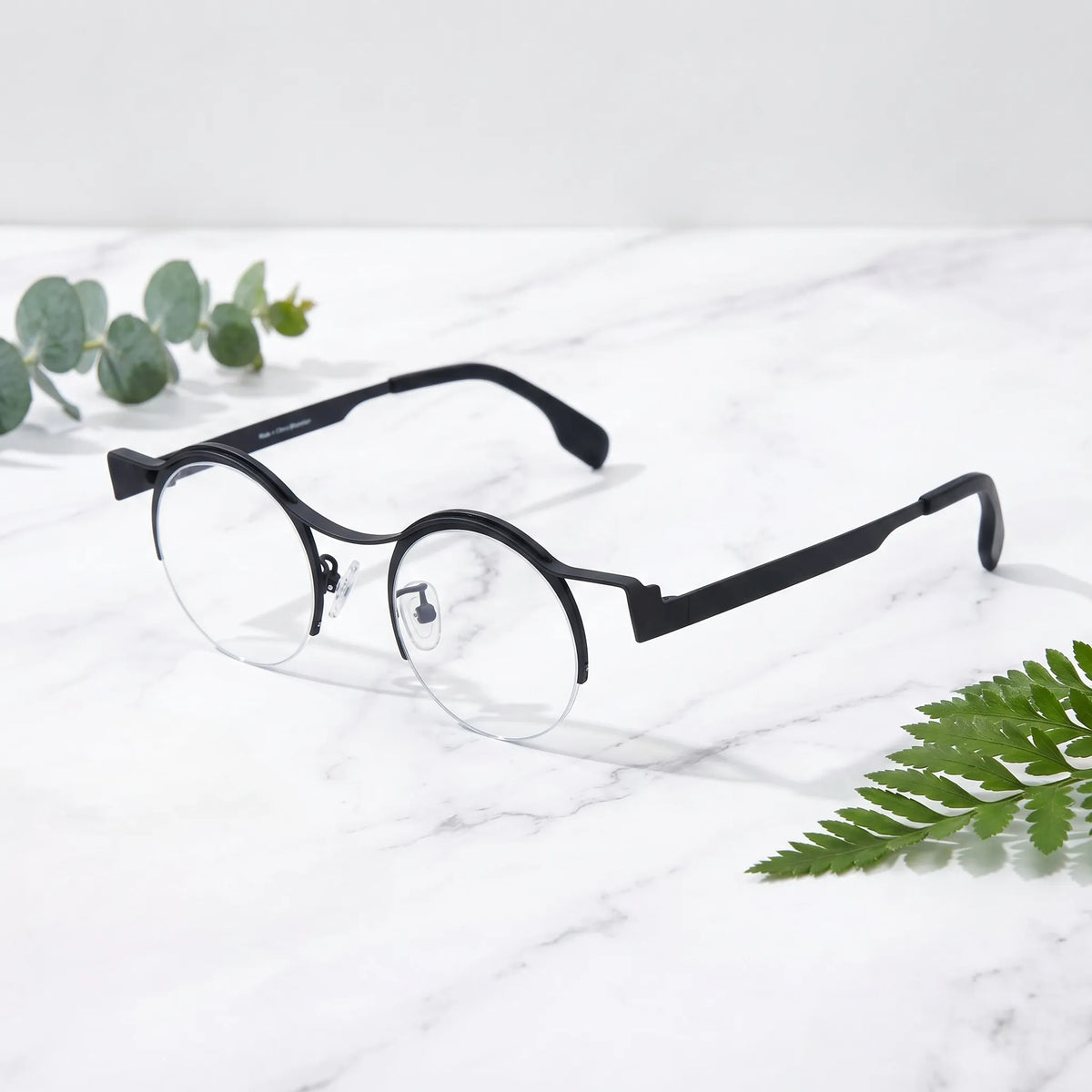 Barledear Classic Noir eyeglasses angled side view showing clean black temples, round lenses, and semi-rimless frame design