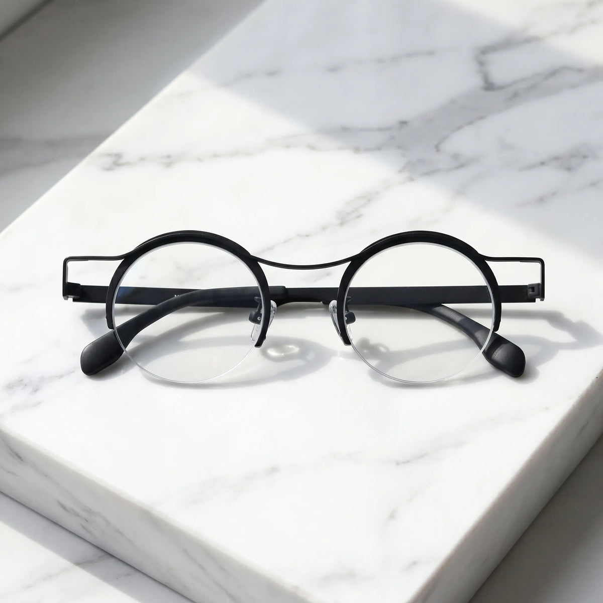 Barledear Classic Noir eyeglasses folded display showing slim black titanium temples and lightweight frame structure