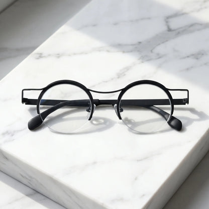 Barledear Classic Noir eyeglasses folded display showing slim black titanium temples and lightweight frame structure