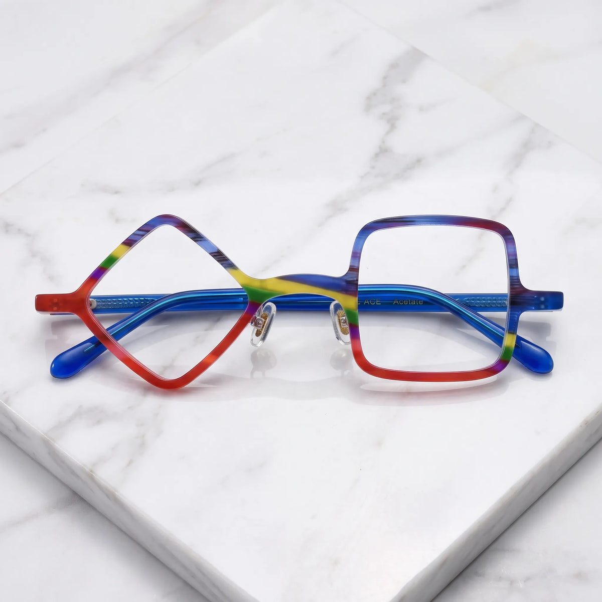 Barledear Cobalt Crimson asymmetric geometric acetate eyeglasses folded display showing the multicolor front, adjustable nose pads, and cobalt-blue temples.