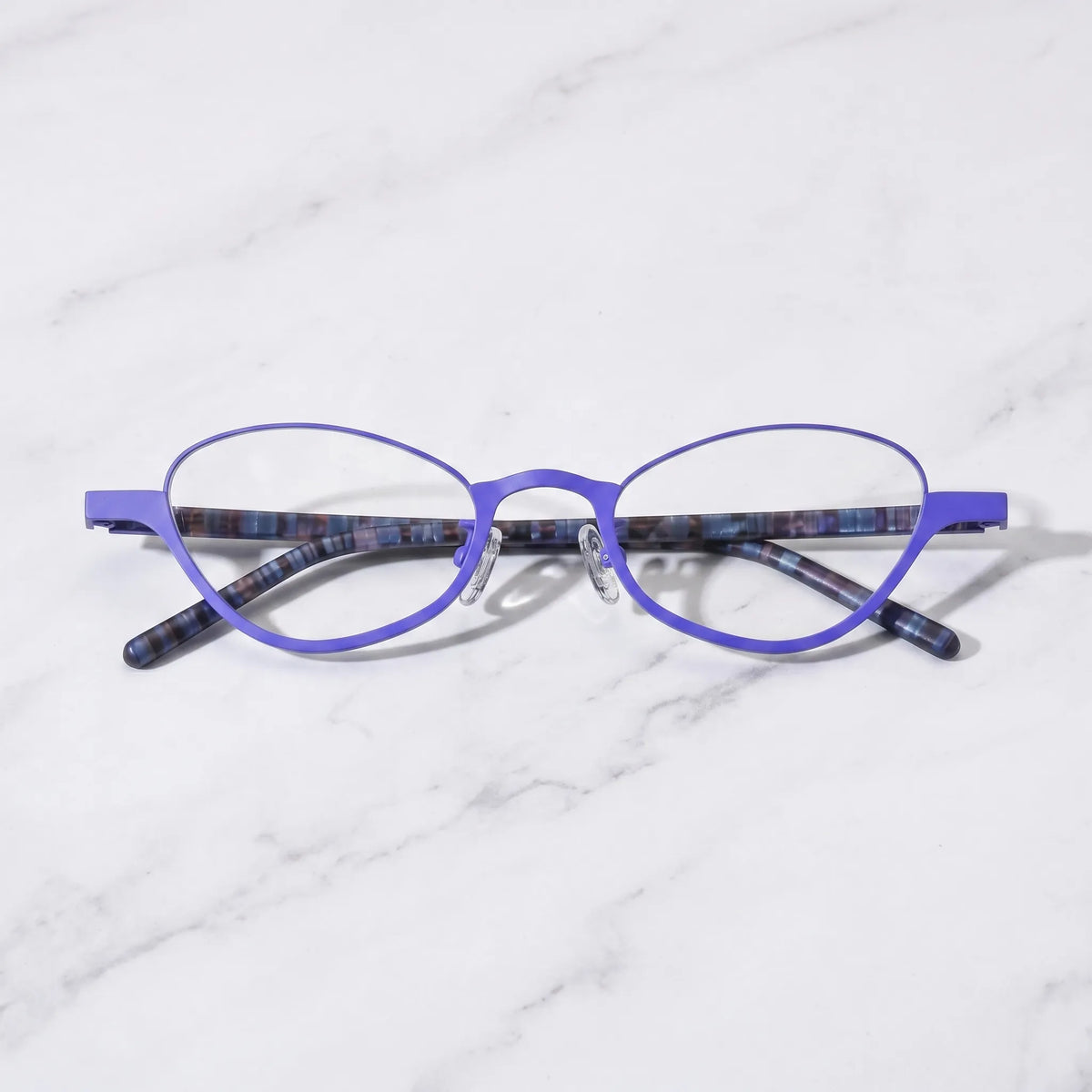 Barledear Cobalt Mosaic eyeglasses folded display showing dark patterned temples and lightweight titanium front