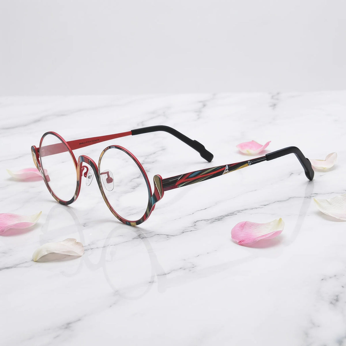 Barledear Crimson Artline eyeglasses angled side view showing slim temples, adjustable nose pads, and a lightweight round full-rim titanium frame