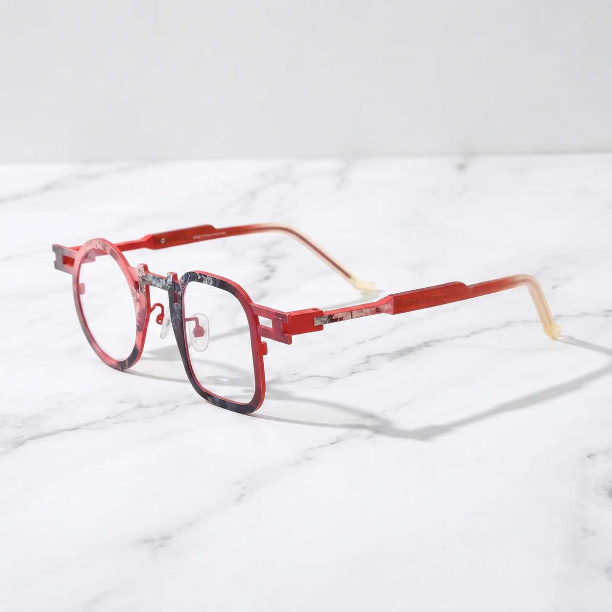 Barledear Crimson Fade eyeglasses angled side view showing slim temples, extended side-bar detail, and adjustable nose pads