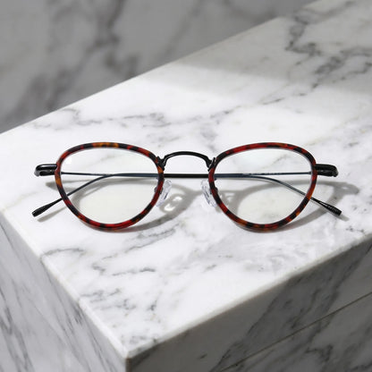 Barledear Crimson Noir eyeglasses folded display showing patterned acetate front and slim black titanium temples