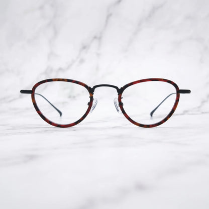 Barledear Crimson Noir eyeglasses shown in a clean lifestyle front view with crimson tortoise acetate and black titanium details