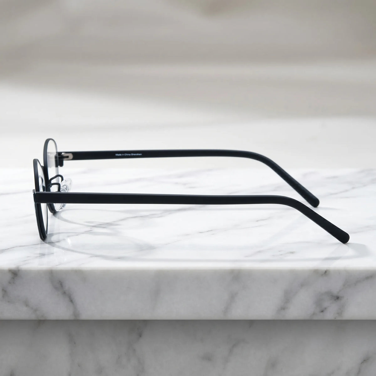 Barledear Crimson Noir eyeglasses angled side view showing slim temples adjustable nose pads and bridge detail