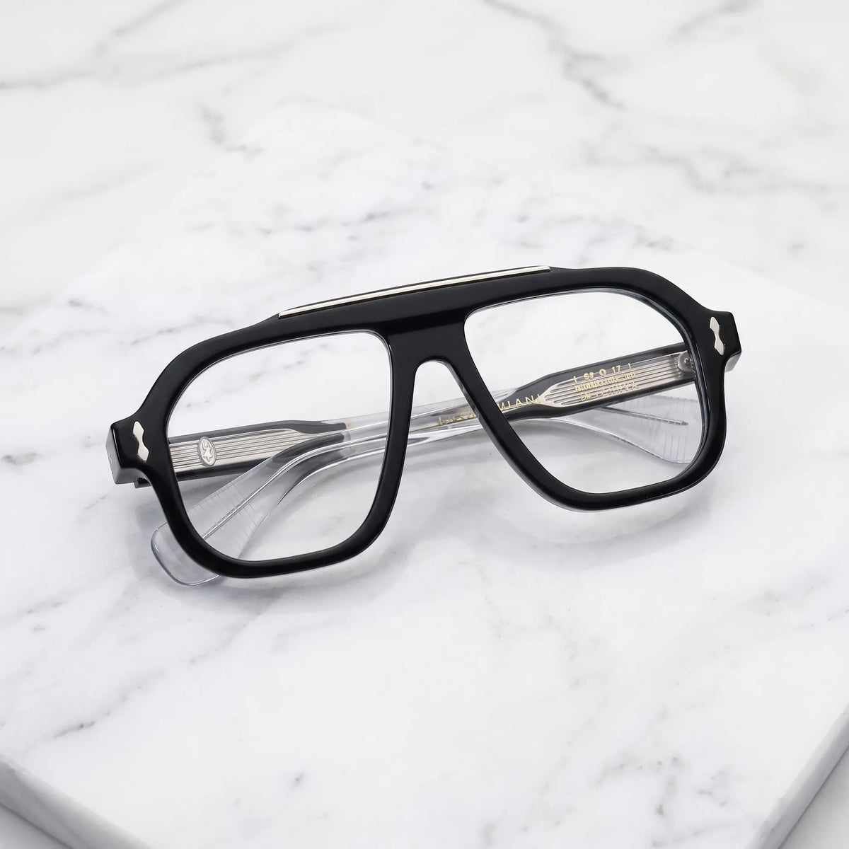 Barledear Crystal Noir eyeglasses folded display showing the polished black acetate front, transparent temples and decorative metal details