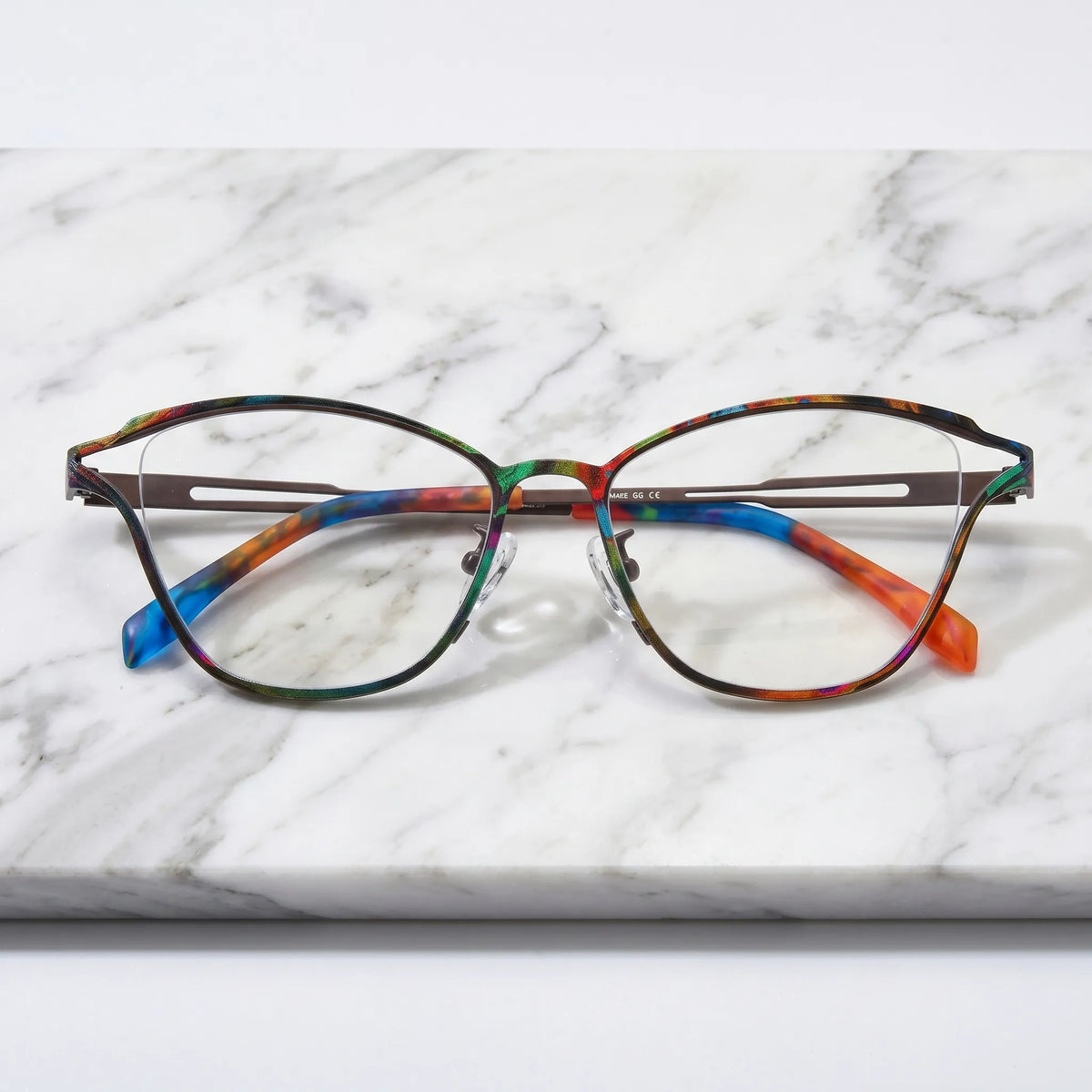 Barledear Dark Prism Tortoise eyeglasses folded display showing slim titanium frame and colorful patterned temple design