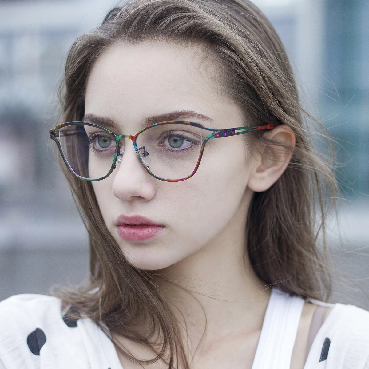 Model wearing Barledear Dark Prism Tortoise eyeglasses in a lifestyle portrait showing lightweight butterfly cat-eye styling