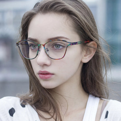 Model wearing Barledear Dark Prism Tortoise eyeglasses in a lifestyle portrait showing lightweight butterfly cat-eye styling