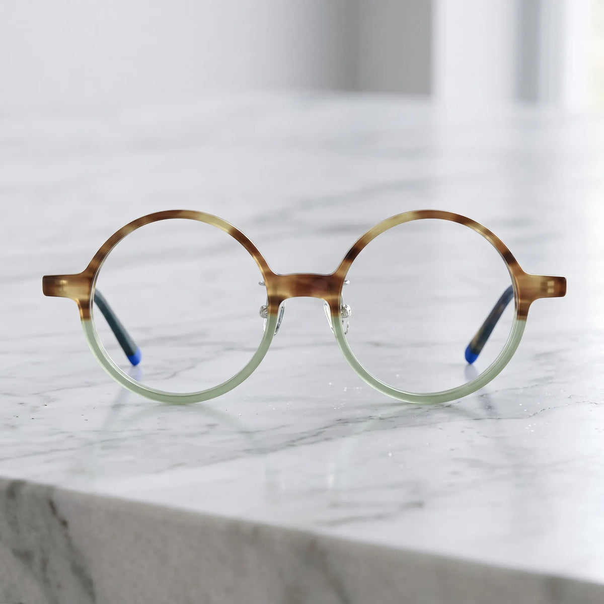 Barledear Frosted Sage Tortoise round acetate eyeglasses shown in a clean lifestyle front view with translucent green and amber tones