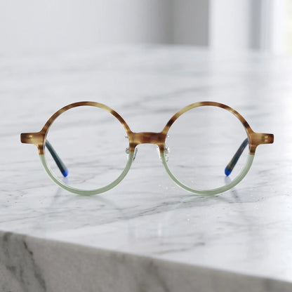 Barledear Frosted Sage Tortoise round acetate eyeglasses shown in a clean lifestyle front view with translucent green and amber tones