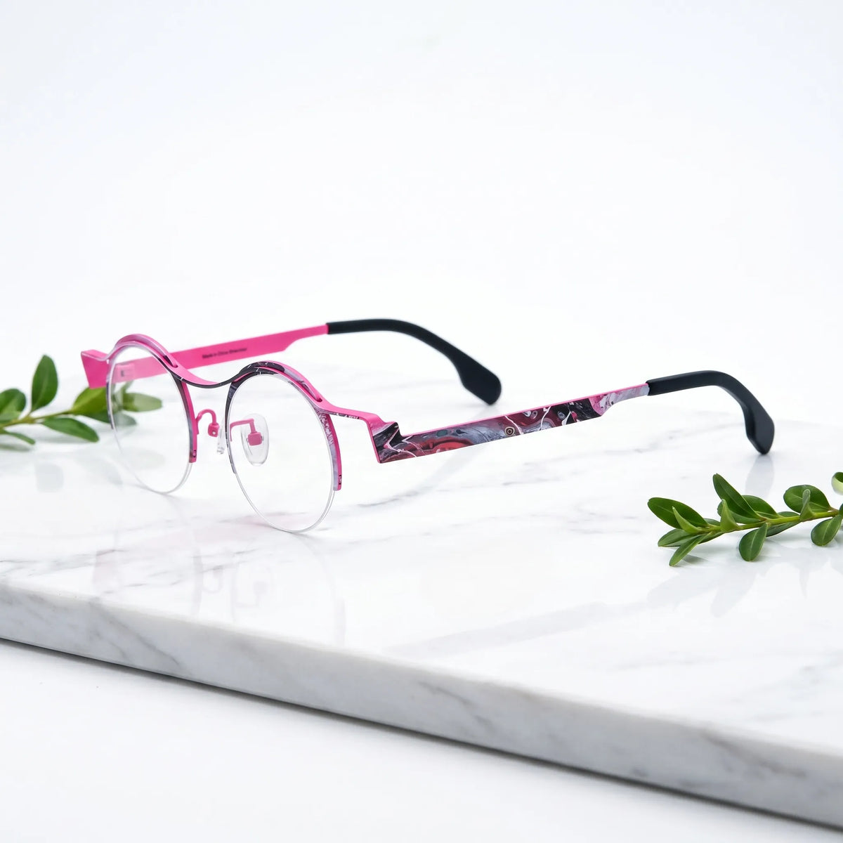 Barledear Fuchsia Marble eyeglasses angled side view showing brown temple details, round lenses, and semi-rimless pure titanium frame