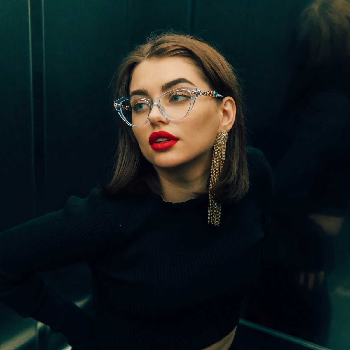 Adult woman wearing Barledear Glacier Blue geometric cat-eye eyeglasses in a bright fashion lifestyle portrait