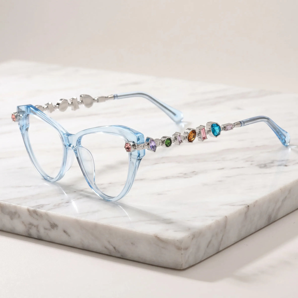 Barledear Glacier Blue eyeglasses angled side view highlighting multicolor geometric crystal accents along the silver-tone temples