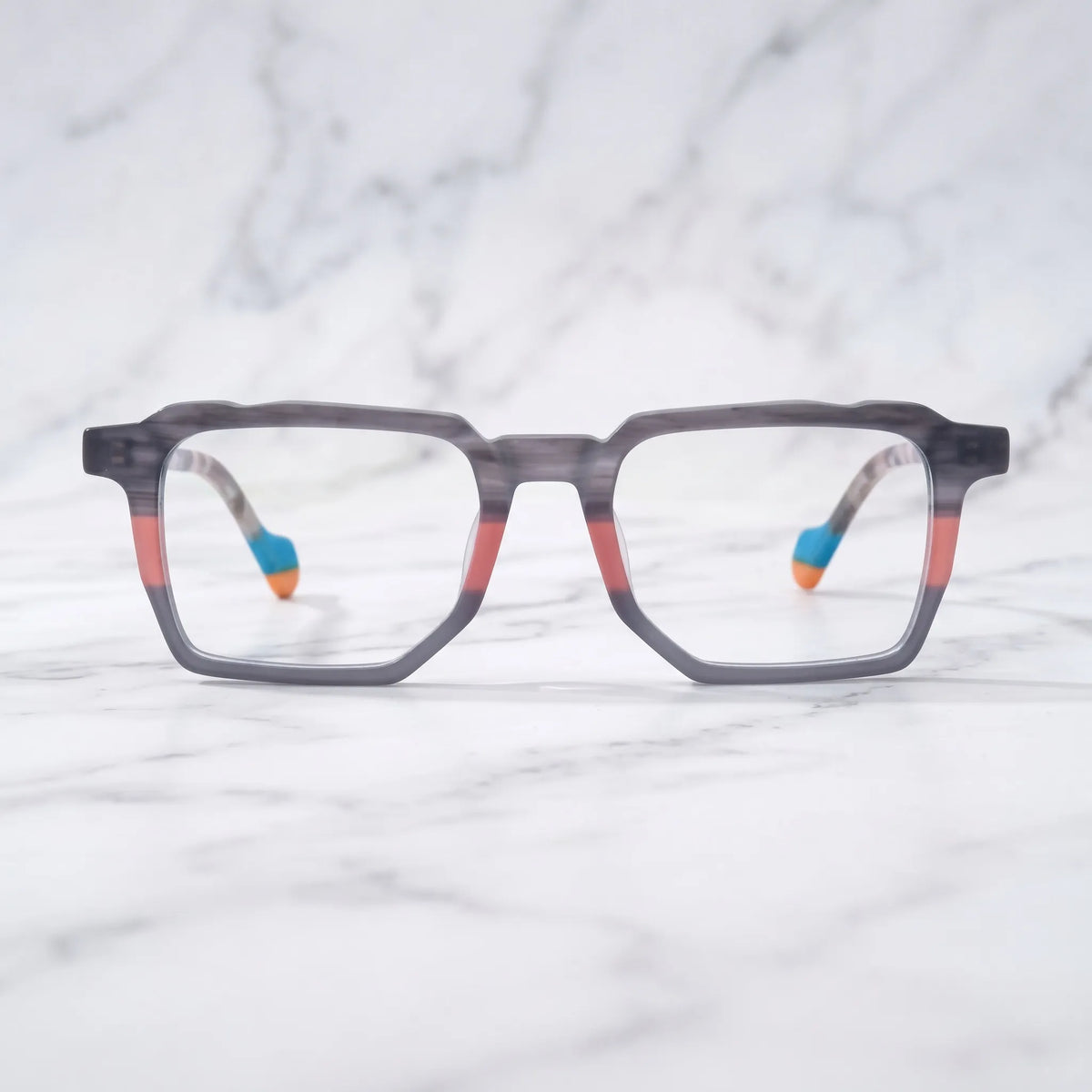 Barledear Graphite Blush eyeglasses shown in a clean lifestyle setting with a gray coral geometric frame