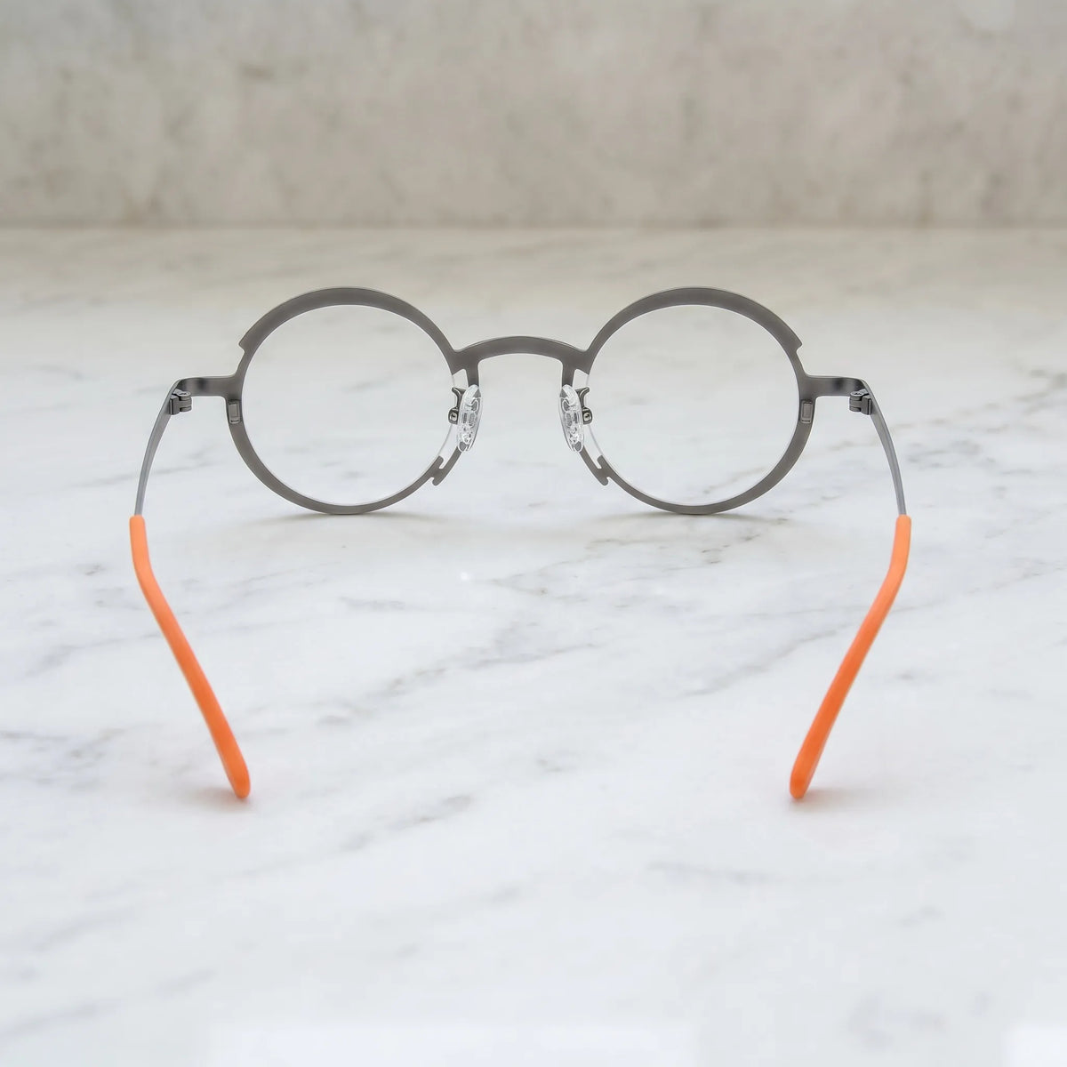 Barledear Graphite Gray Citrus Orange eyeglasses back view showing the round full-rim frame structure, nose pads, temples, and color-block details
