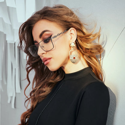 Model wearing Barledear Graphite Gunmetal eyeglasses with modern square titanium frame in a lifestyle portrait