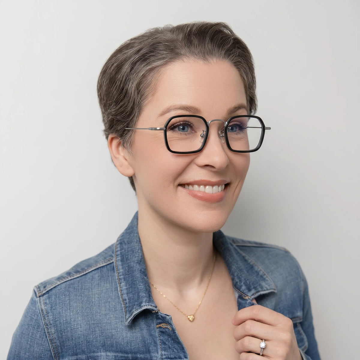 Model wearing Barledear Graphite Titanium Silver eyeglasses in a lifestyle portrait