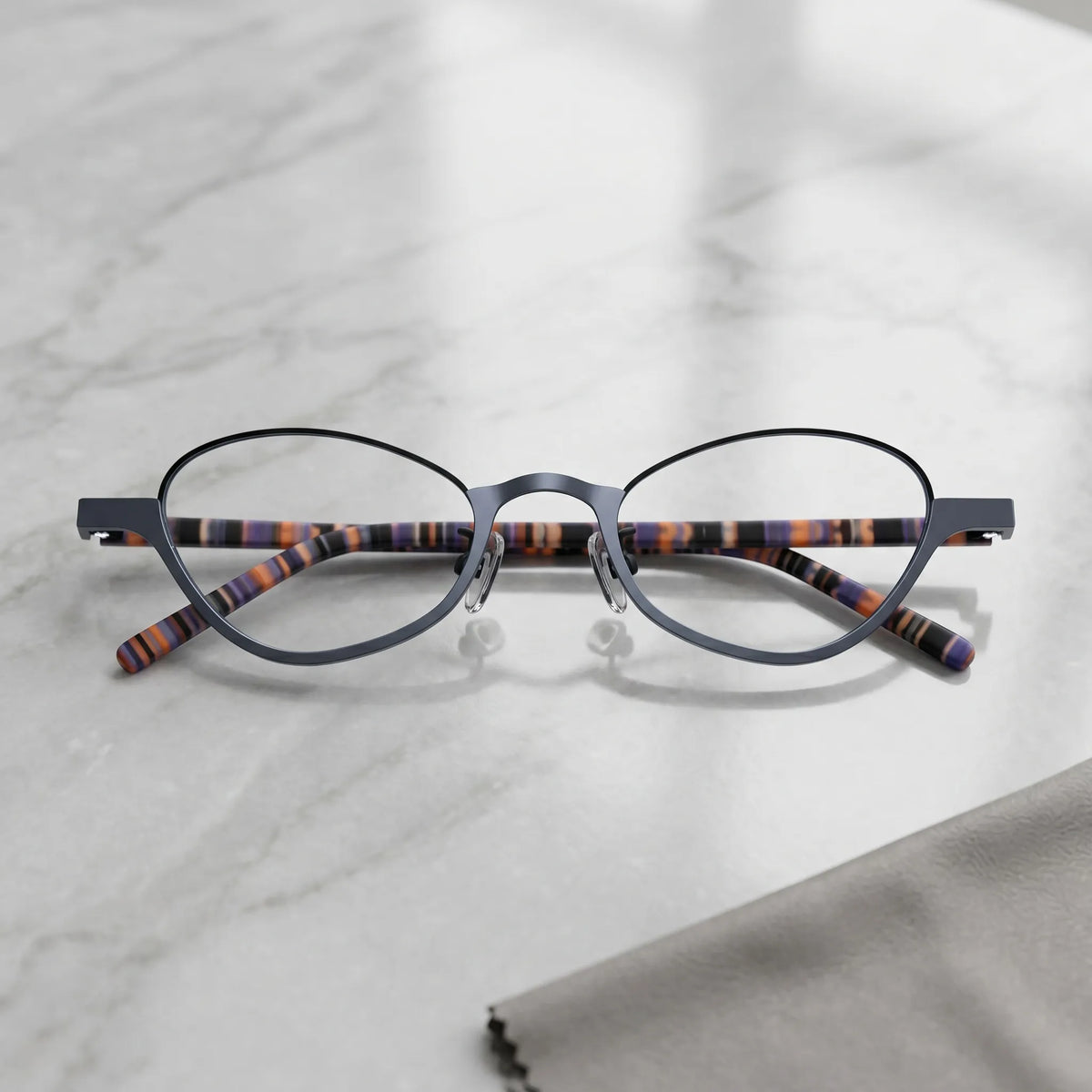 Barledear Graphite Tortoise eyeglasses folded display showing tortoise-patterned temples and slim titanium frame