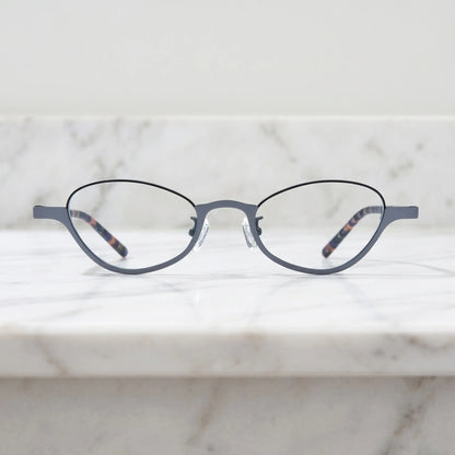 Barledear Graphite Tortoise eyeglasses shown in a clean lifestyle front view with modern gray oval frame