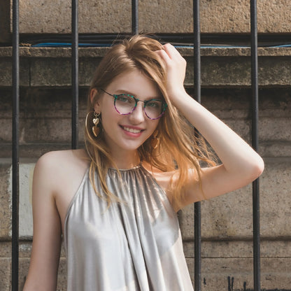 Model wearing Barledear Jade Violet eyeglasses in a lifestyle portrait showing the retro oval acetate metal frame