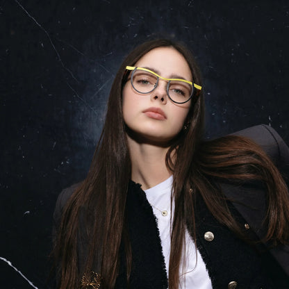 Model wearing Barledear Lemon Noir Amber eyeglasses in a lifestyle portrait