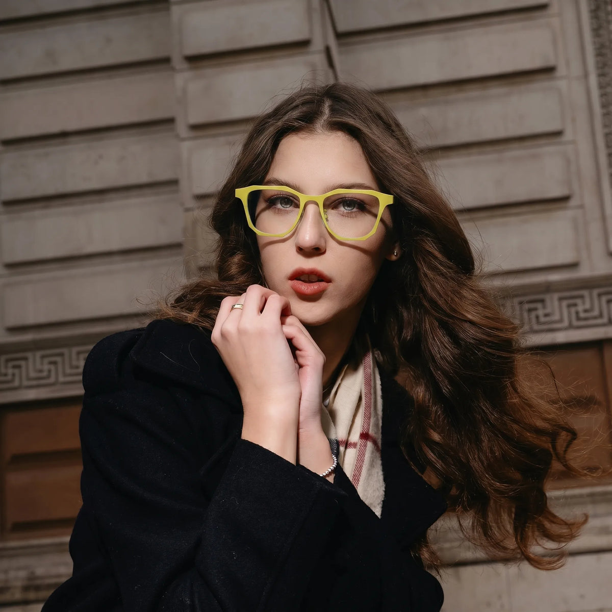 Model wearing Barledear Lemon Tortoise eyeglasses with colorful square titanium frame in a stylish lifestyle portrait