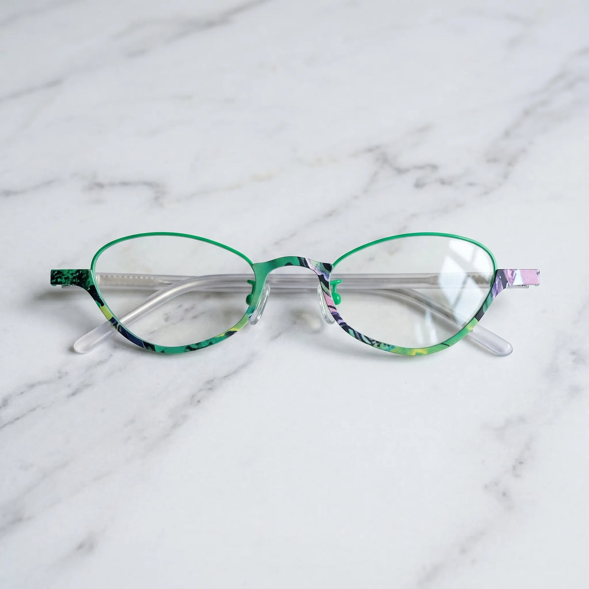 Barledear Meadow Jade eyeglasses folded display showing green titanium front and clear patterned temple arms