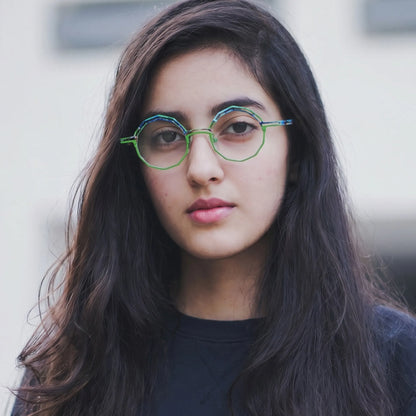 Model wearing Barledear Meadow Lime eyeglasses in a lifestyle portrait
